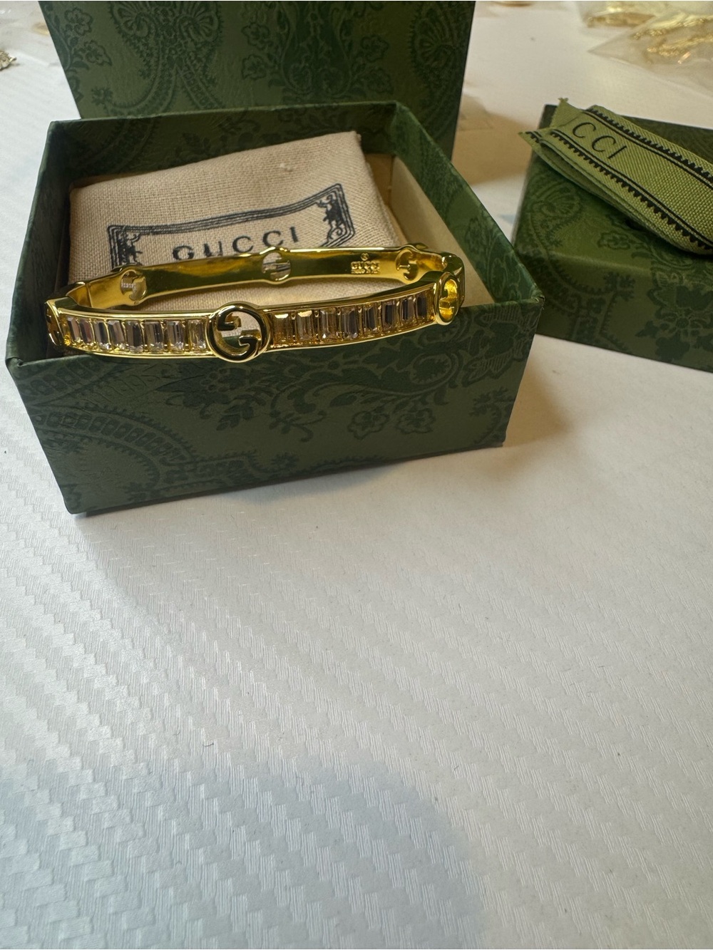 Gucci Gold Bracelet with Clear Baguette Crystals and Interlocking Gs - Picture 6 of 7